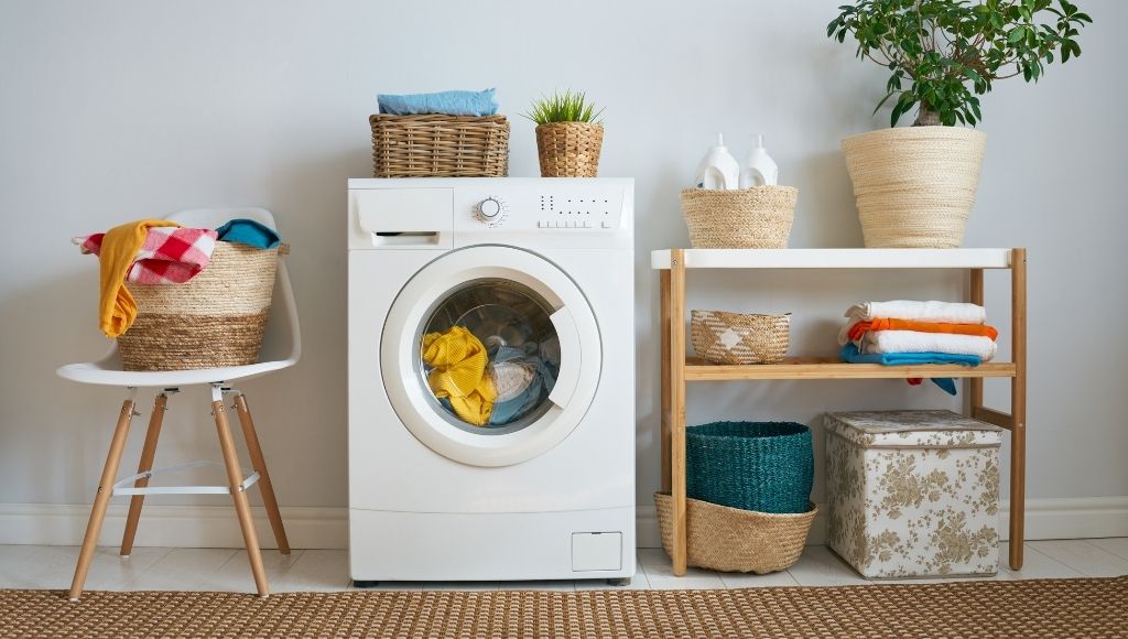 A laundry room with a washing machine