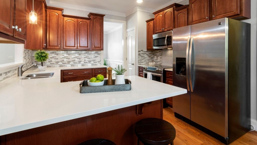 A big smart fridge in the kitchen on the right side